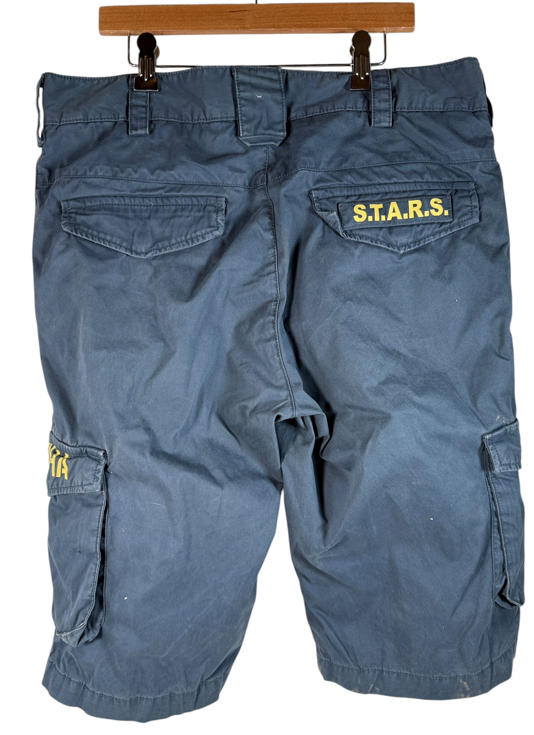 Authentic Resident Evil S.T.A.R.S. cargo shorts with official Capcom tags. Rare mid-2000s game merch in great condition. Ideal for collectors and fans.