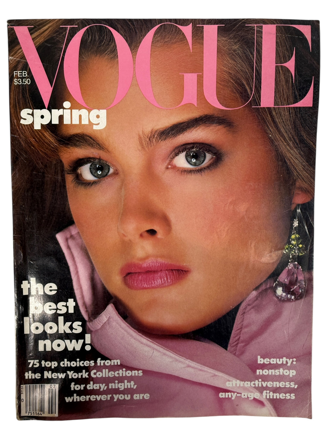 Vintage Vogue US February 1985 featuring Brooke Shields. Classic 80s spring fashion and beauty editorials. Original issue with visible spine wear.