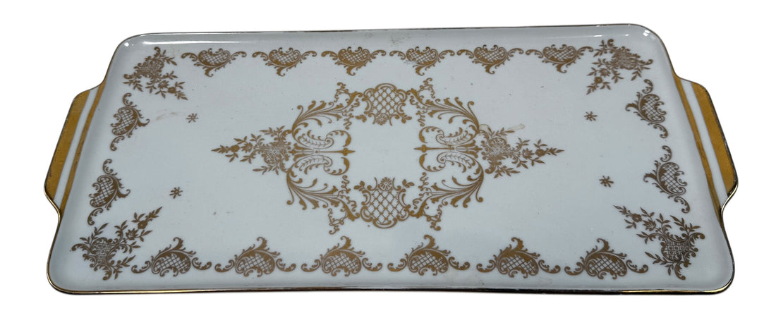 Vintage German porcelain serving tray by R.P.M. with ornate gold gilt and floral décor. Mid-century elegance for tea service or display.