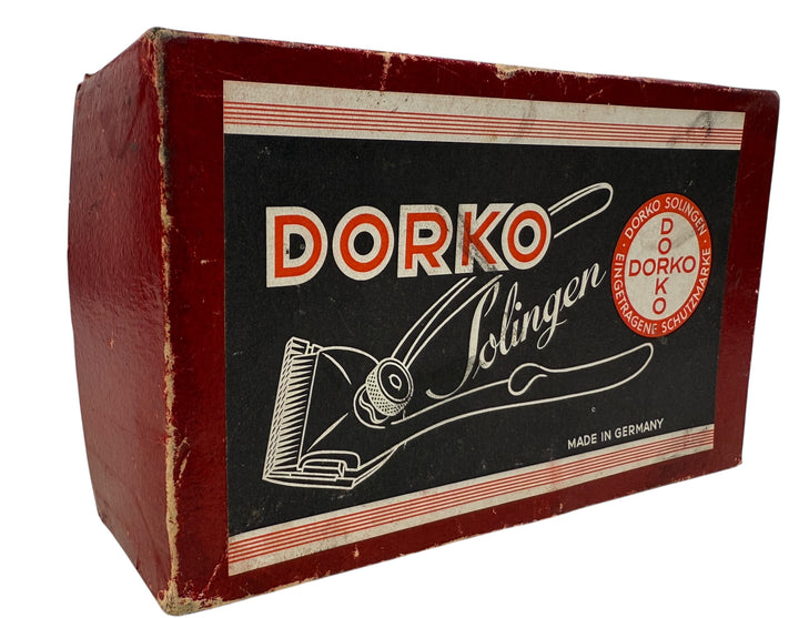 Vintage Dorko Solingen chrome #000 manual hair clipper with original box. German-made grooming tool for collectors, barbers, and vintage display.