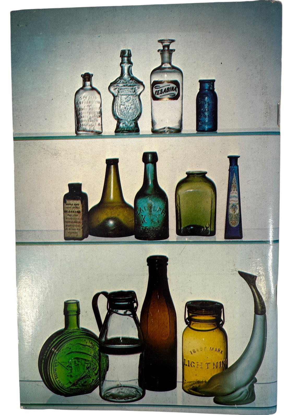 Vintage Bottle Collecting Manual with pricing, photos, and guides for early American flasks, bitters, sodas and antique glass collectors.