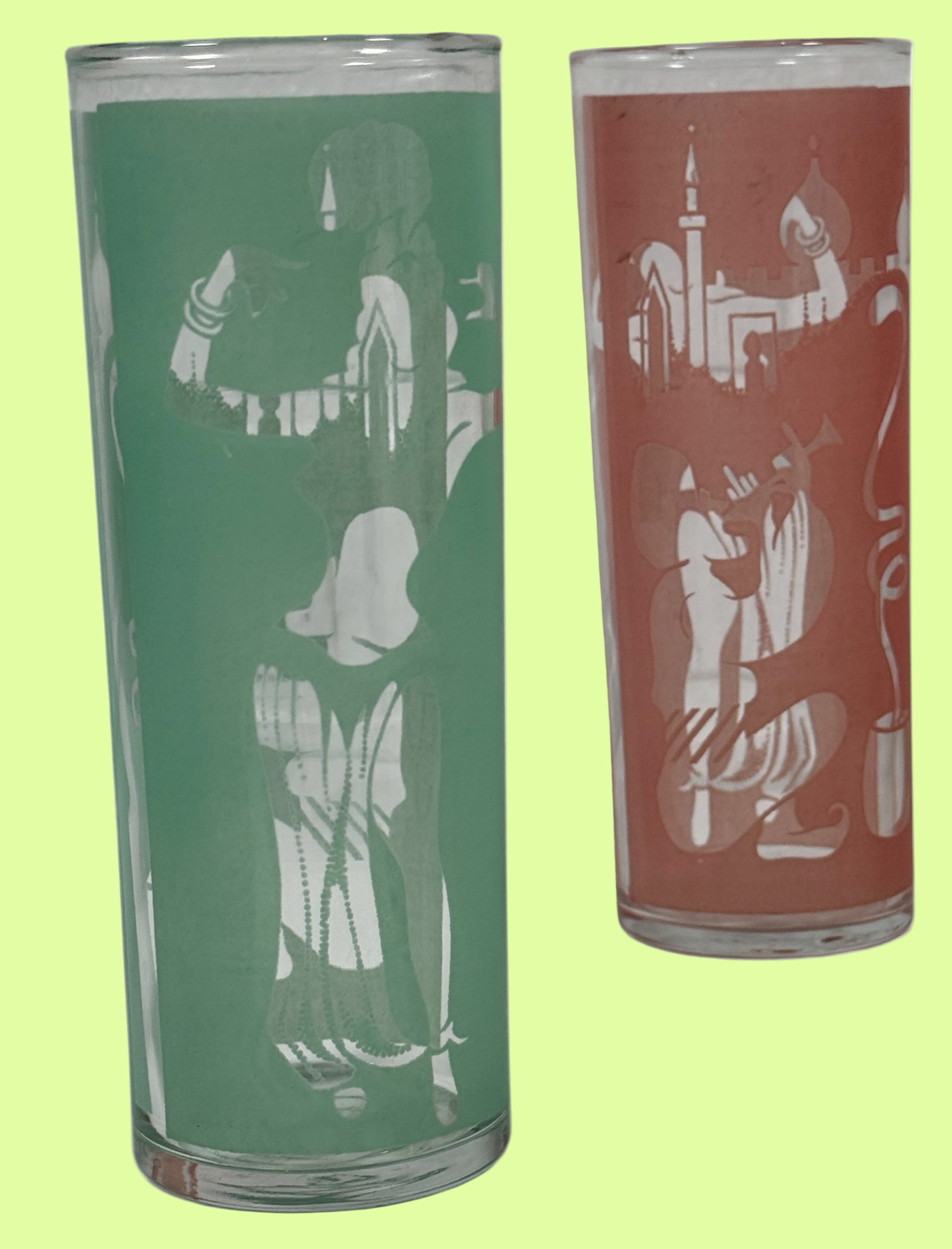 Two glass tumblers with etched designs on a white background
