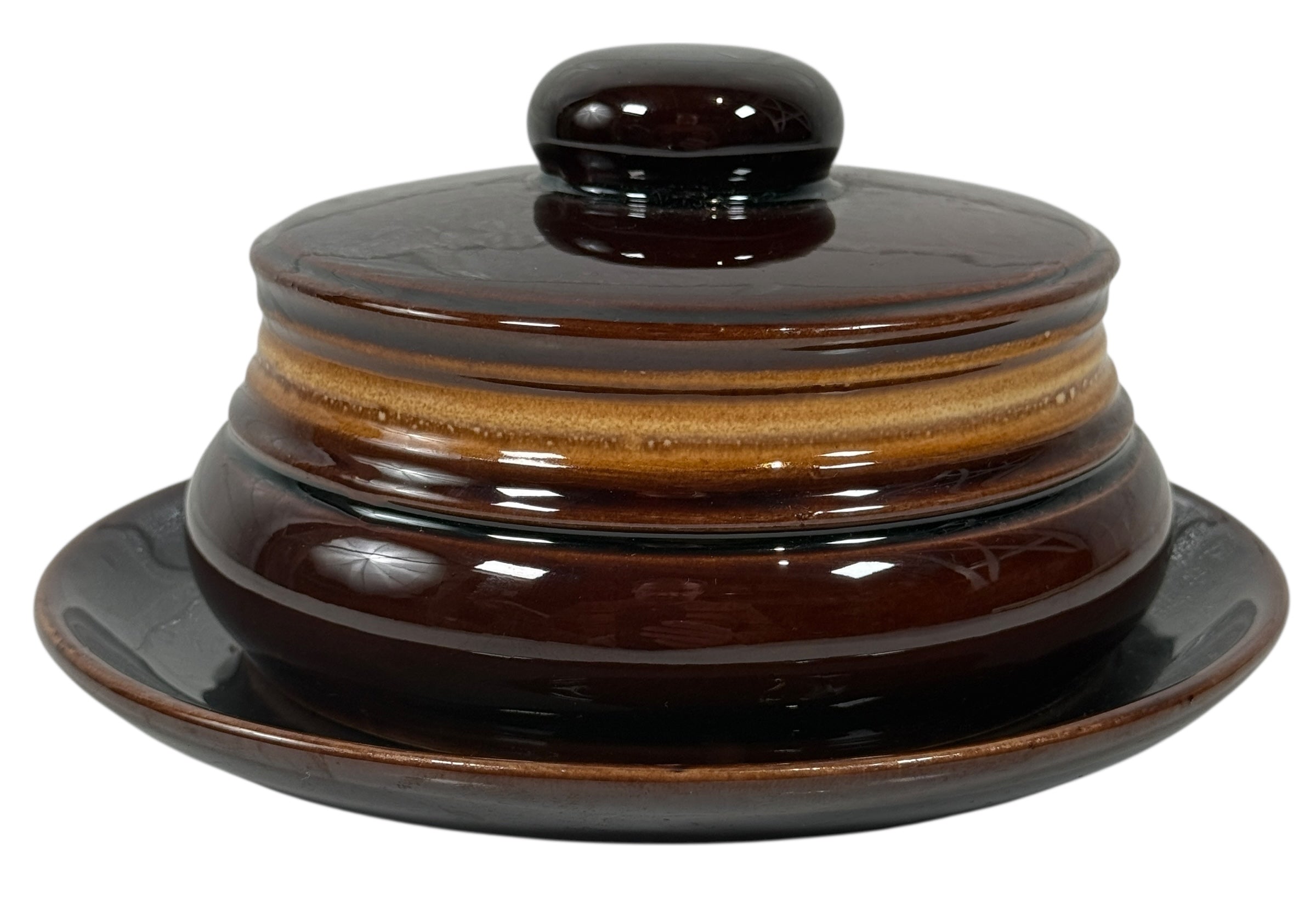 Brown ceramic dish with lid on a white background