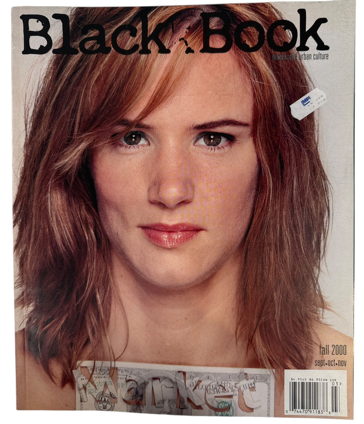 Magazine cover featuring a woman with a barrette, titled 'Black Book'.