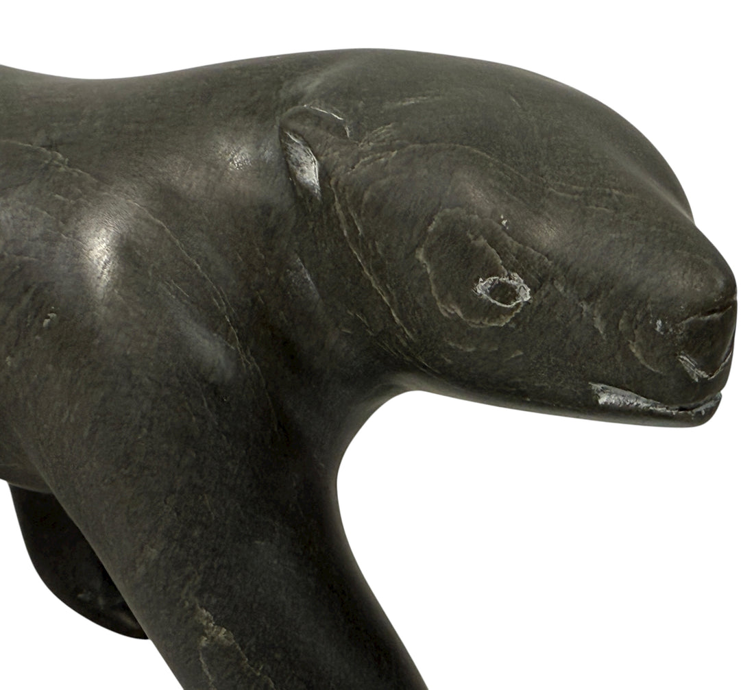 Signed Inuit soapstone bear by Joe Ittukalak (2004) from Nunavik. 10-inch Canadian carving in dark stone—authentic Indigenous art sculpture.
