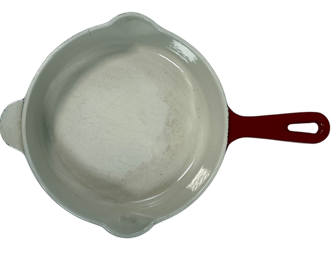 Vintage Cousances Le Creuset #16 enameled cast iron skillet in Flame red. French-made, functional with vintage wear. Great for cooking or display.