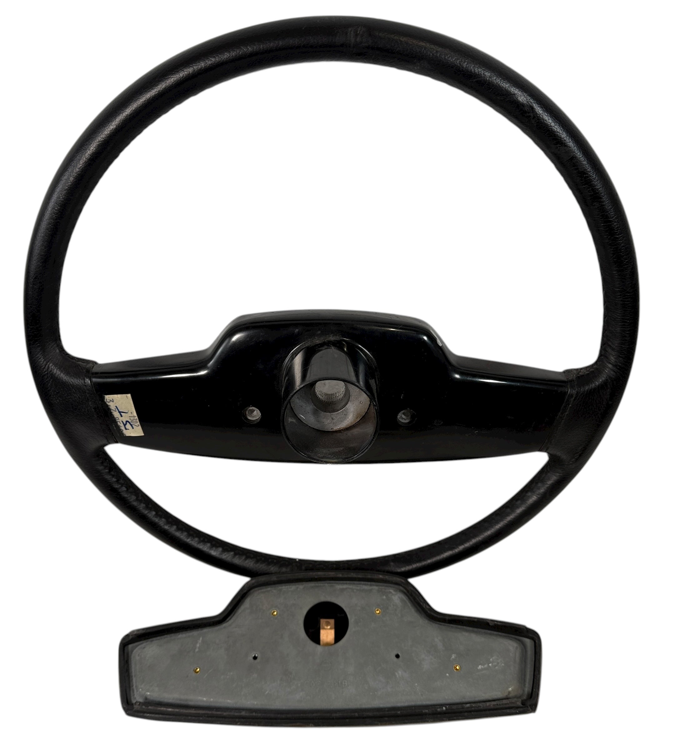 OEM Jaguar XJ6 Series III steering wheel with horn pad. Genuine 1980–87 UK-made replacement part in good driver condition. Vintage Jaguar interior collectible.