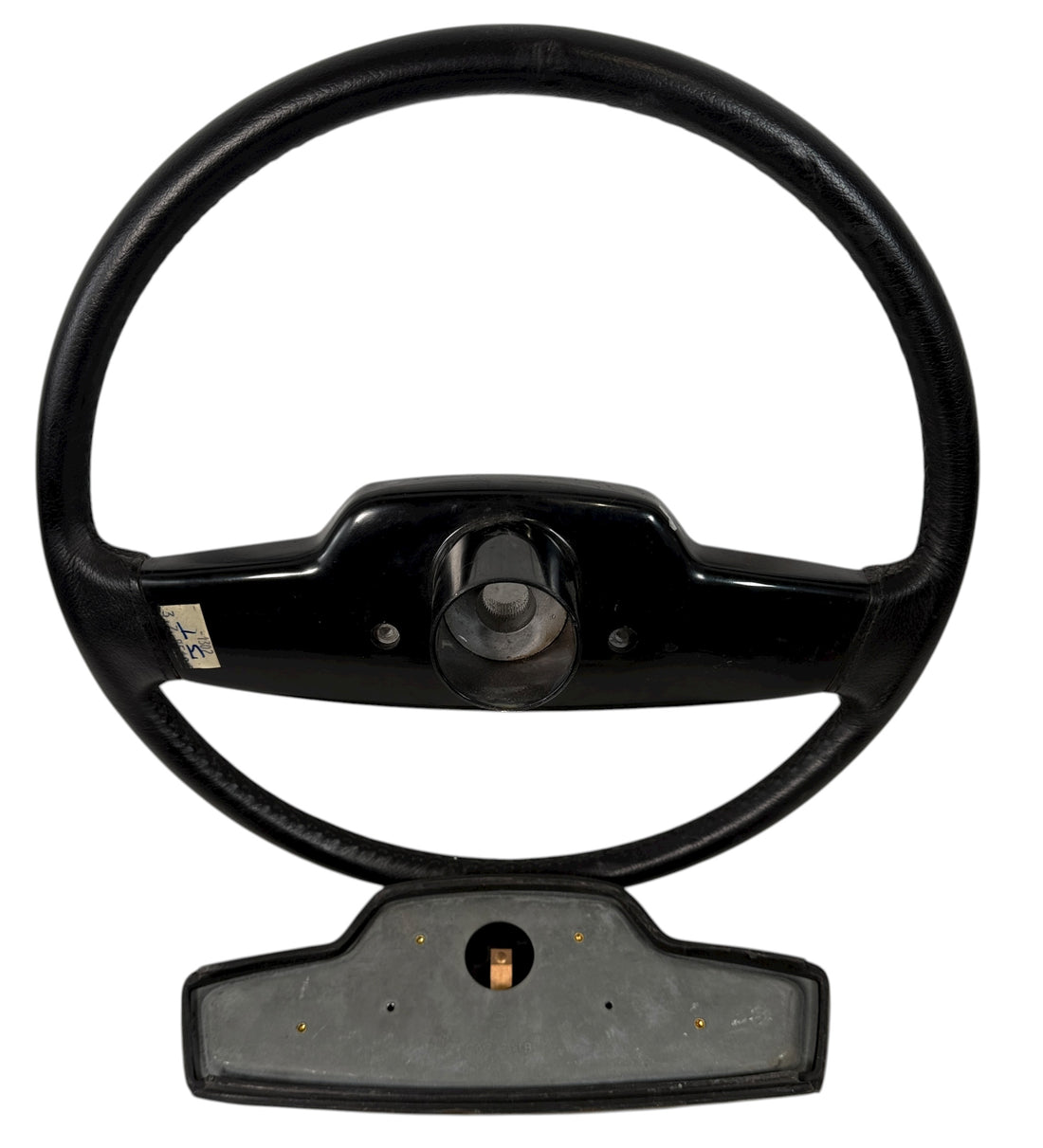 OEM Jaguar XJ6 Series III steering wheel with horn pad. Genuine 1980–87 UK-made replacement part in good driver condition. Vintage Jaguar interior collectible.