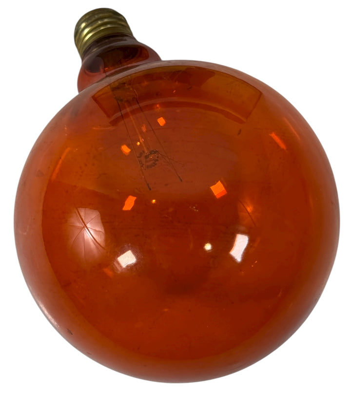 Vintage Noma orange glass globe bulb for outdoor or décor use. Large G-series size, solid glass, E26 base. Ideal for retro lighting and collectors.
