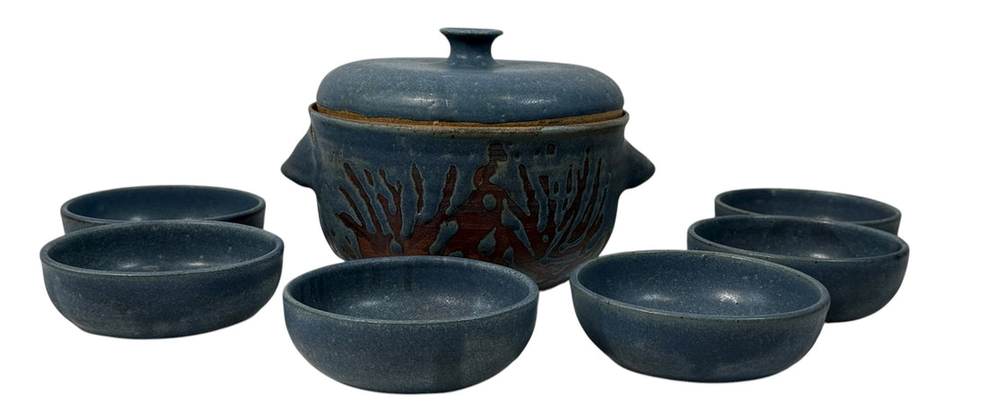 Handmade Québec studio pottery set signed Achard. Includes carved casserole with lid and six blue bowls. Vintage artisan ceramic tableware in excellent condition.