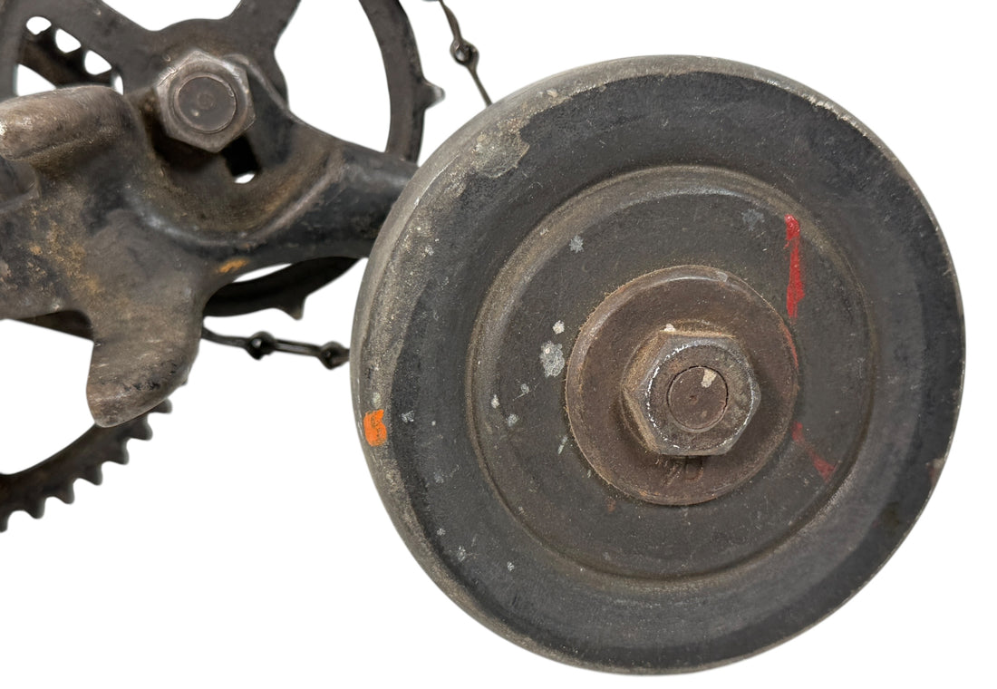 Working antique clamp-on cast-iron grinder with chain drive. Compact 19th-century sharpening tool, fully functional. Industrial décor or collector piece.