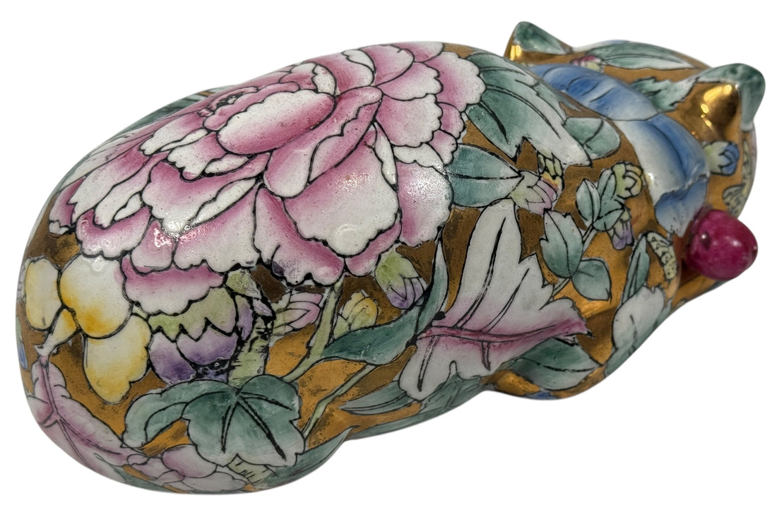 Large 10” Famille Rose porcelain reclining cat with floral enamels and gilt details. Mid-century Chinese export decor piece. Beautiful display sculpture.