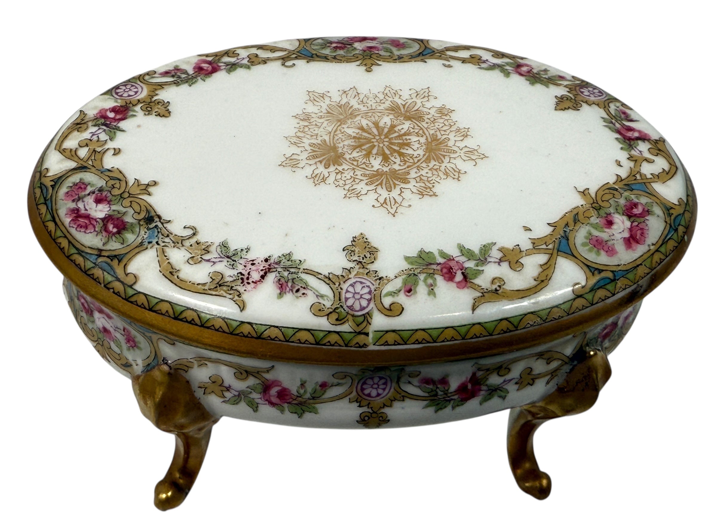 Antique French-style porcelain trinket box with gilt bronze legs, c.1900. Elegant vanity décor with floral details and classic Belle Époque charm.