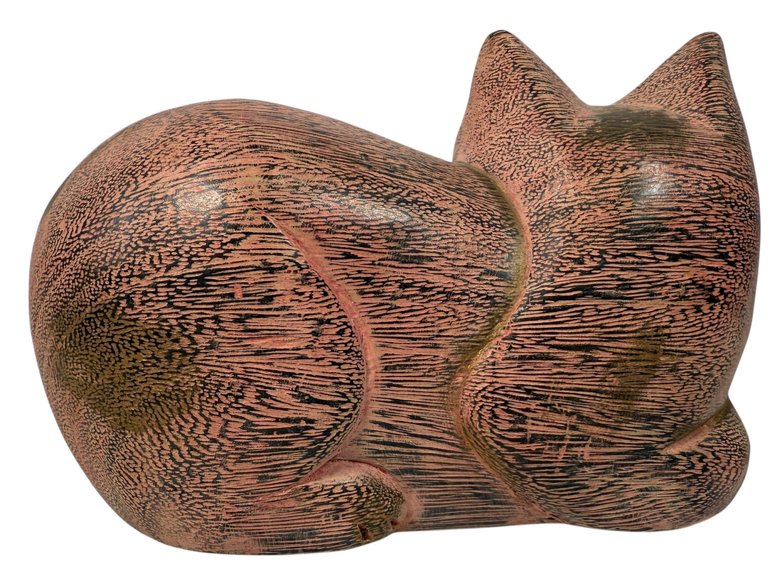 Hand-carved wooden cat sculpture in folk art style. Solid wood, decorative carved texture, warm natural finish. Unique décor piece for cat lovers.