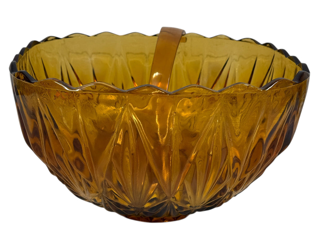 Vintage mid-century amber glass punch bowl set with cups and ladle. Classic starburst pattern, complete set, perfect for retro entertaining.