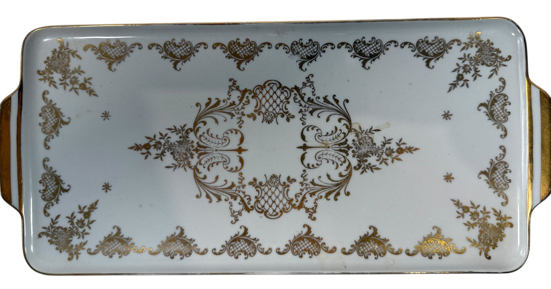 Vintage German porcelain serving tray by R.P.M. with ornate gold gilt and floral décor. Mid-century elegance for tea service or display.