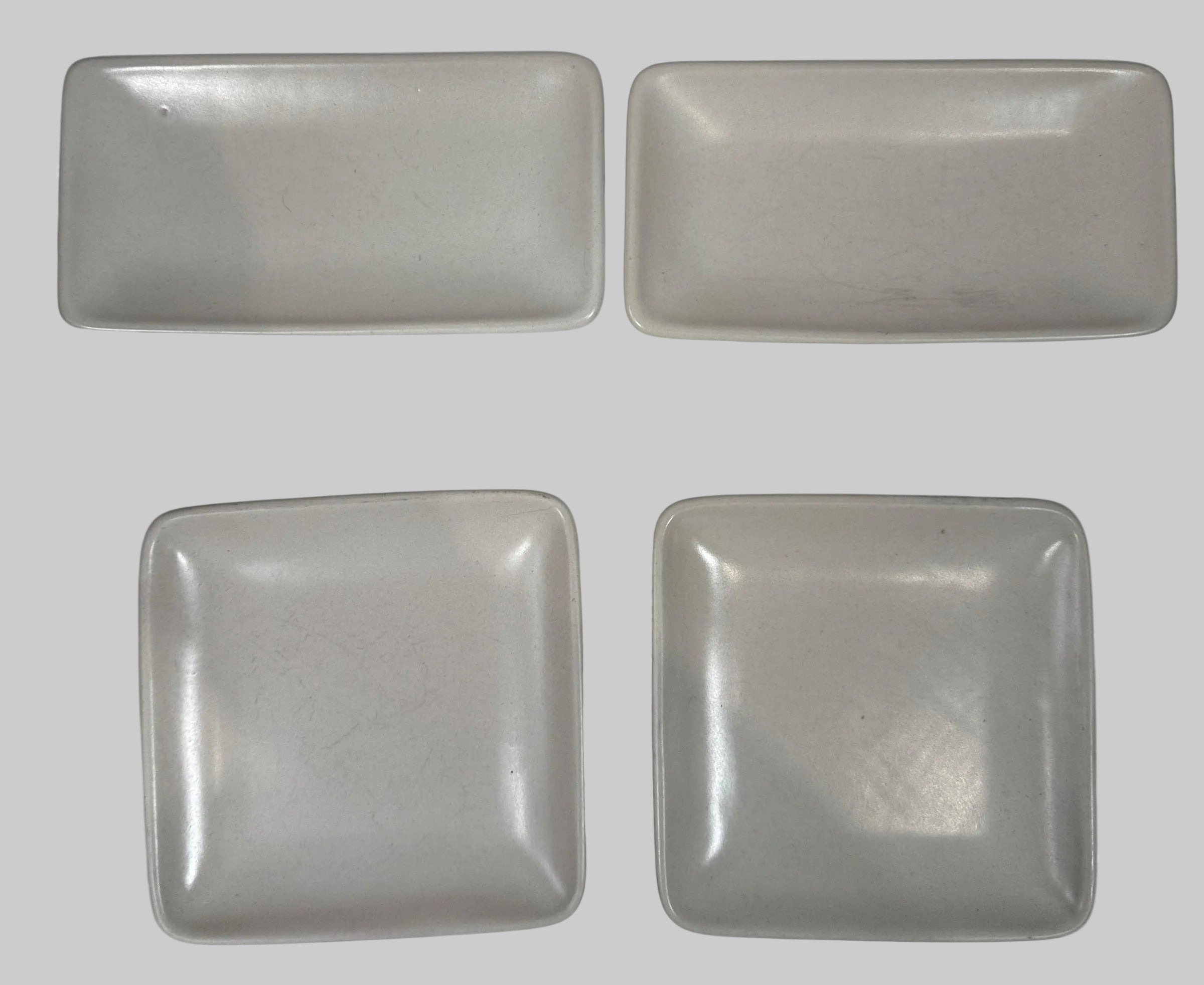 Heath Ceramics 7-piece stoneware serving set with modern matte white glaze. Restaurant-grade California design. Durable and collectible modern tableware.