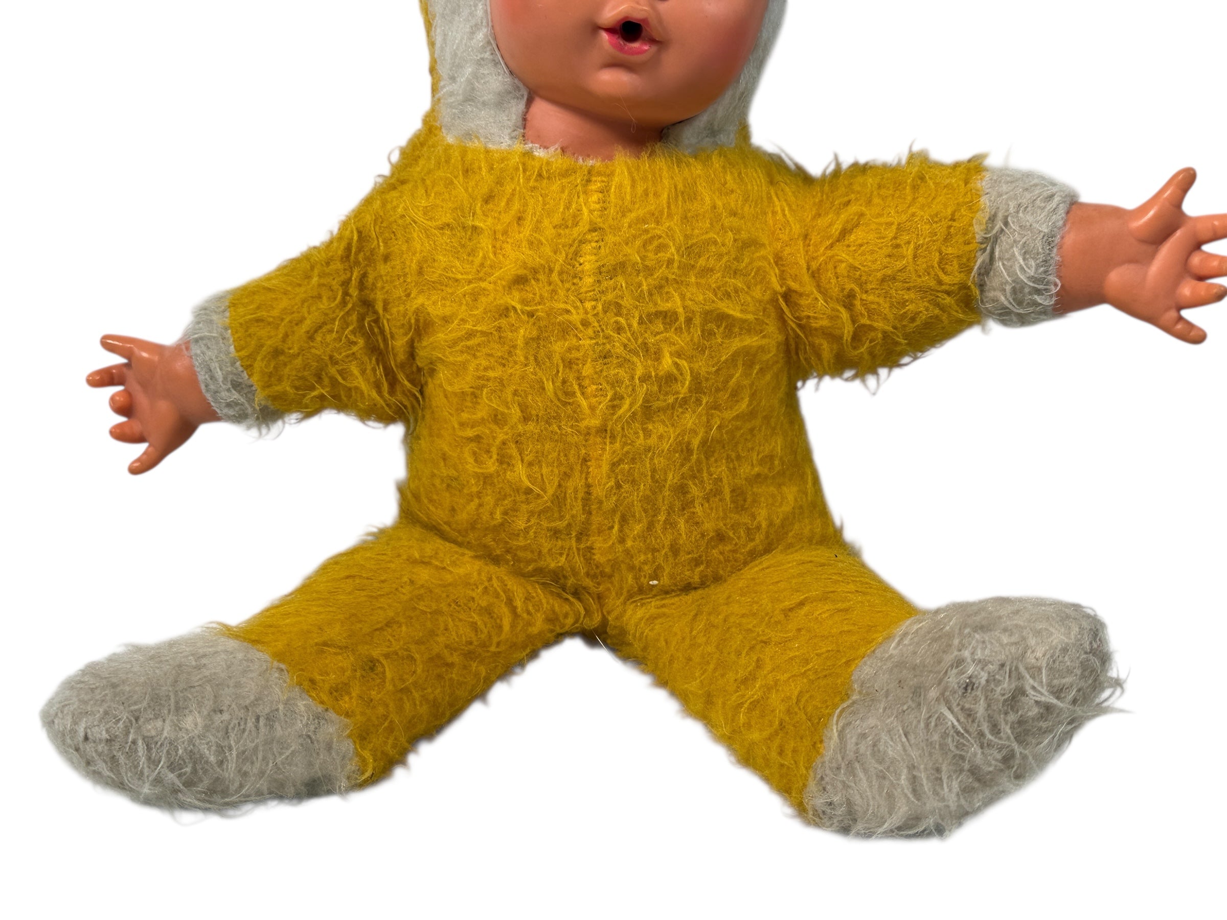 Vintage 1950s wind-up musical baby doll in yellow plush suit with vinyl face. Music plays well. Great display collectible. Ships from Canada.