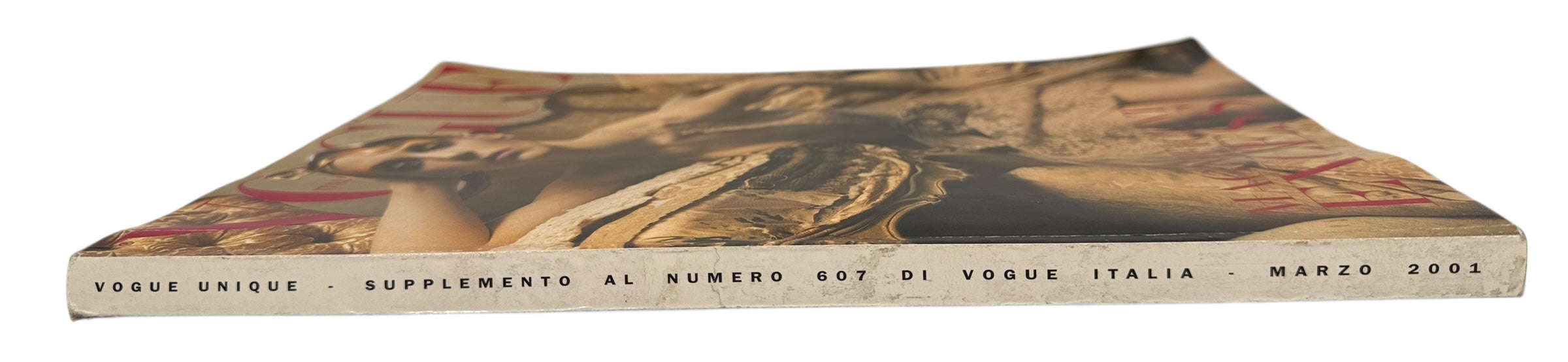 Vogue Italia Unique March 2001 supplement featuring Magnificent Excess with Steven Meisel and Franca Sozzani era editorials. Collectible fashion issue.