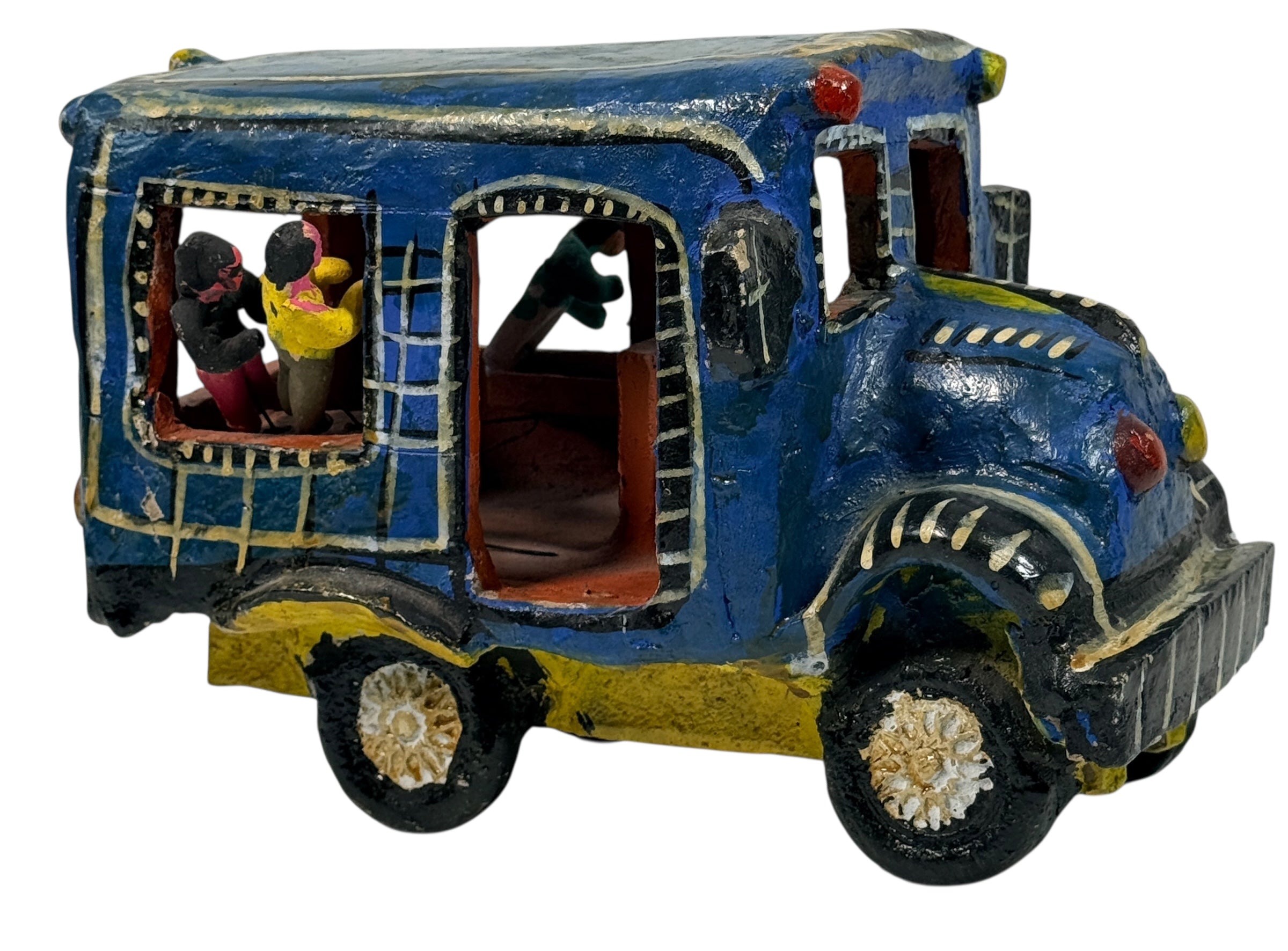 Vintage Mexican papier-mâché colectivo bus sculpture with hand-modeled interior figures. Folk art narrative piece with bold color and strong display presence.
