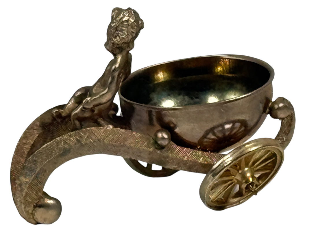 Bronze decorative item resembling a chariot with a bowl on a white background