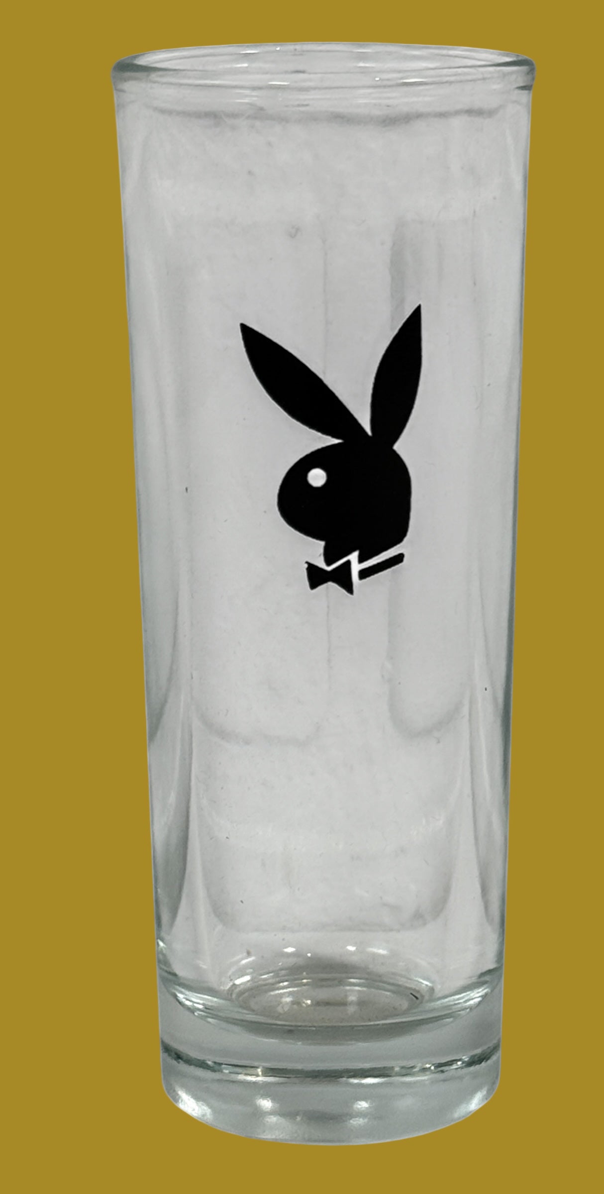Clear glass with Playboy Bunny logo on a white background