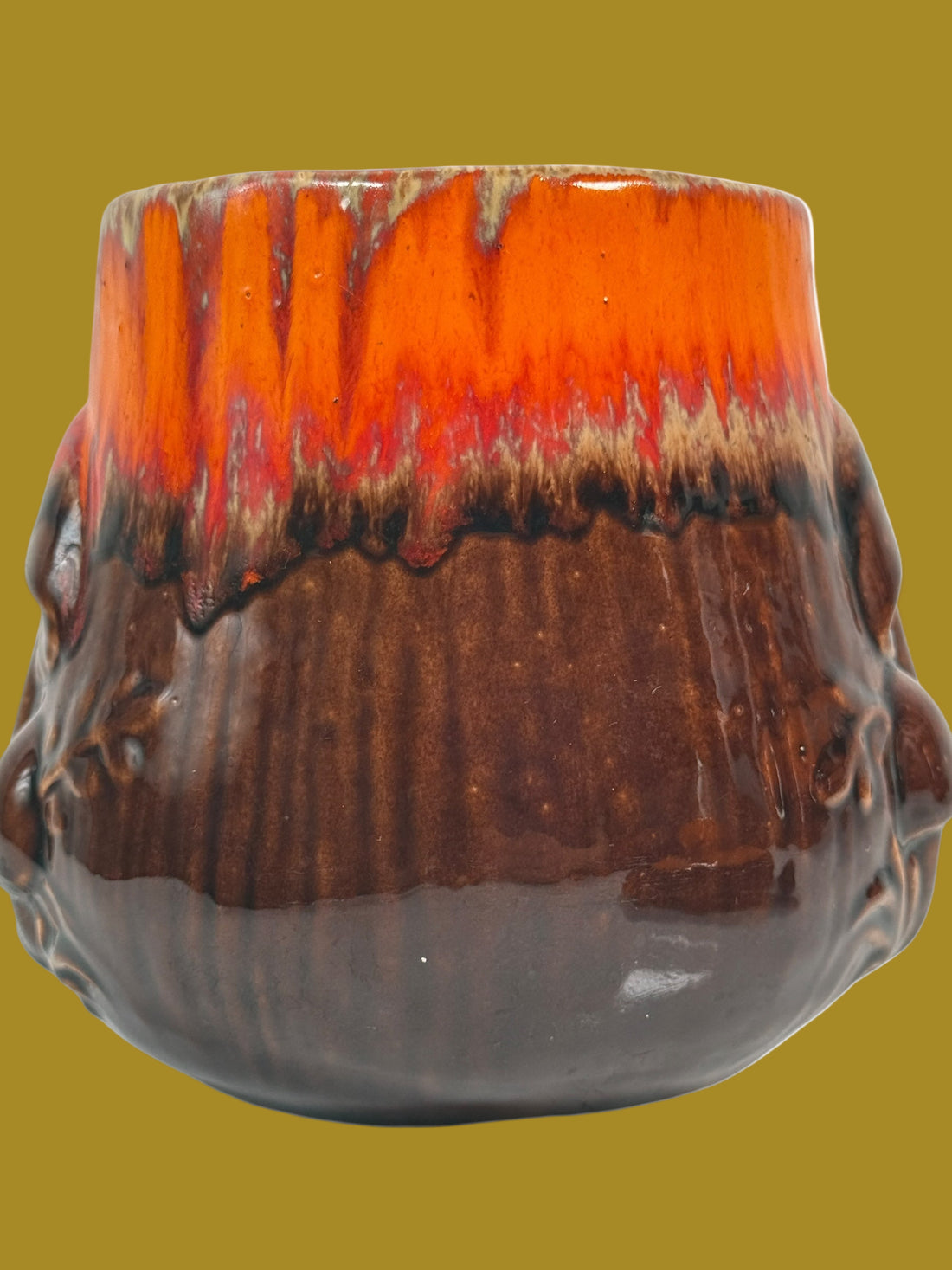 Ceramic vase with a gradient from orange to brown on a white background