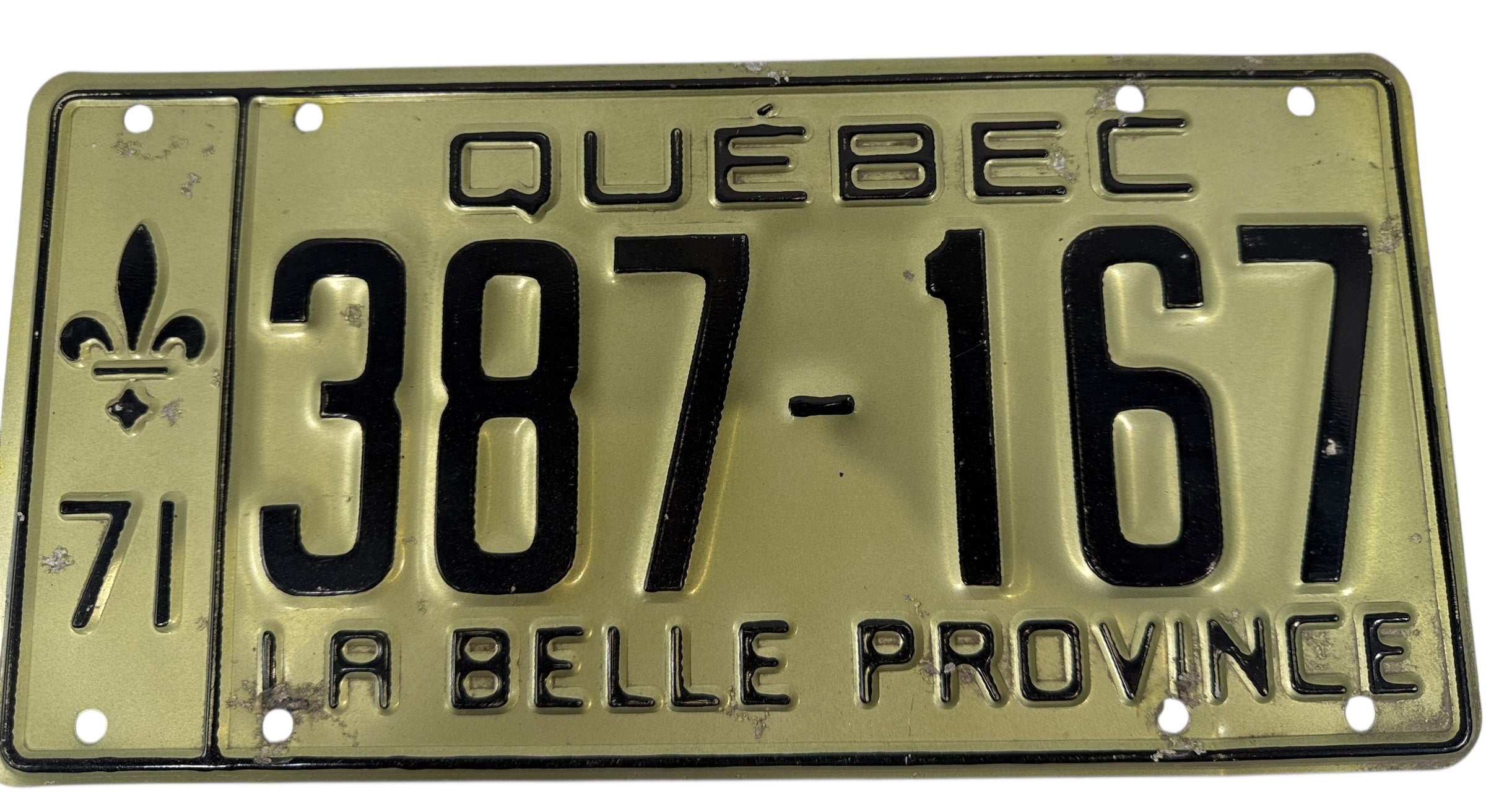 Quebec license plate with text and number '387-167' on a beige background