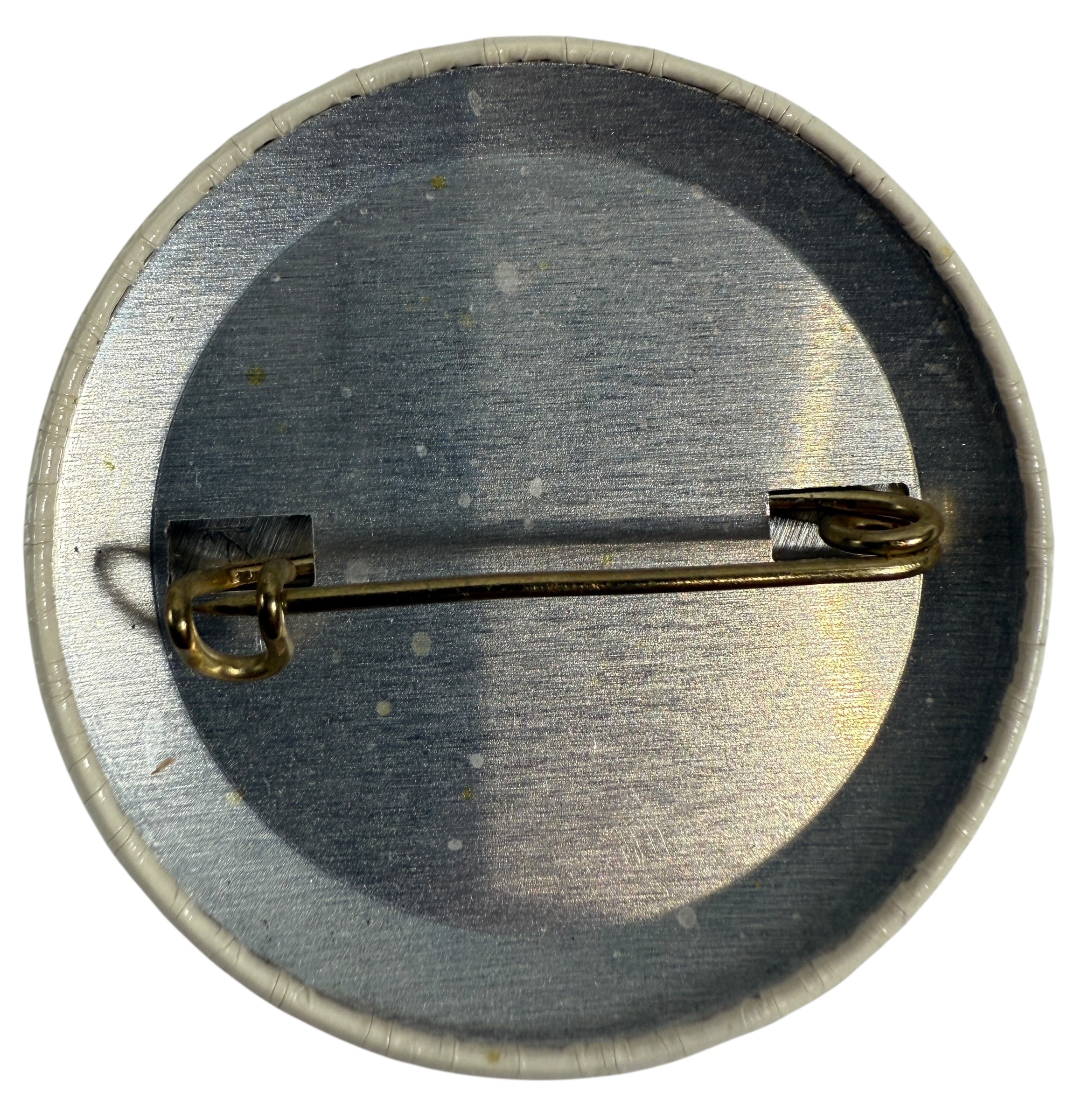 1976 Olympic Button badge with 'Amik' text and black silhouette of a beaver with a red stripe 