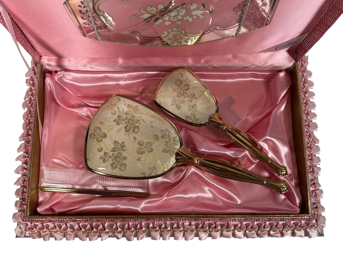 Vintage Claude vanity set with mirror, brush &amp; comb in original pink satin box. Elegant 1950s dressing table décor collectible.