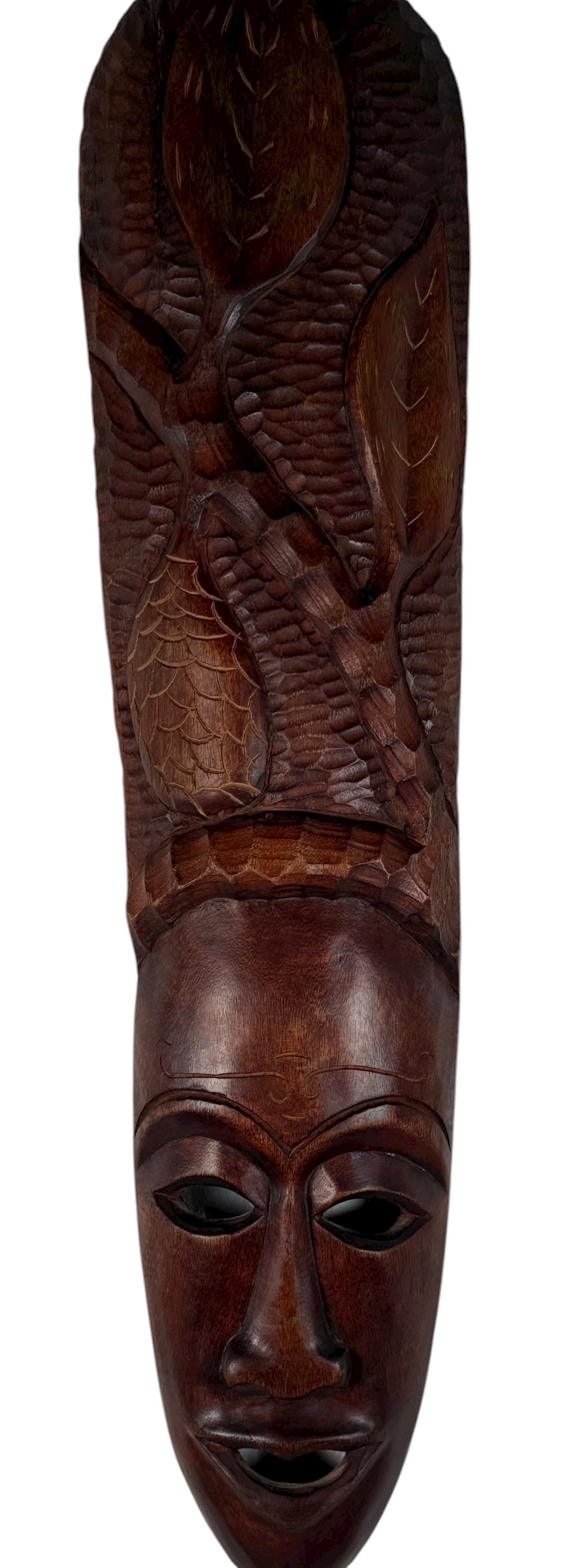 Carved wooden mask with intricate patterns on a white background