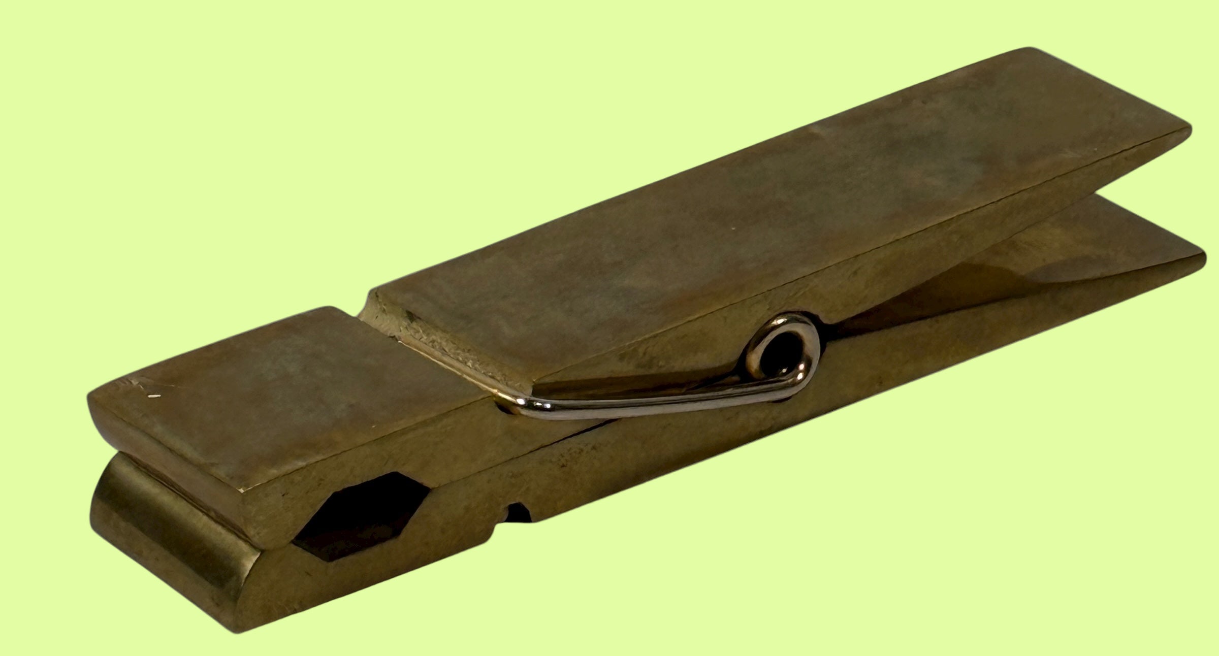 Vintage 1970s brass oversized clothespin clip with colorful enamel inset—5¾″ desk paperweight or décor accent. Mid-century modern charm.