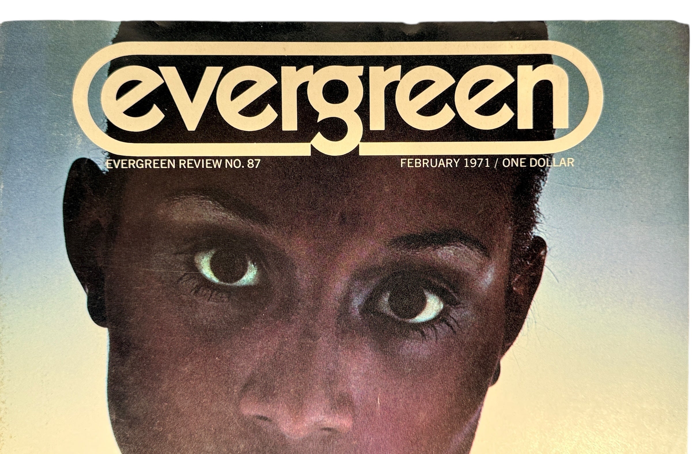 Cover of 'Evergreen' magazine from February 1971 with a close-up of a person's face.