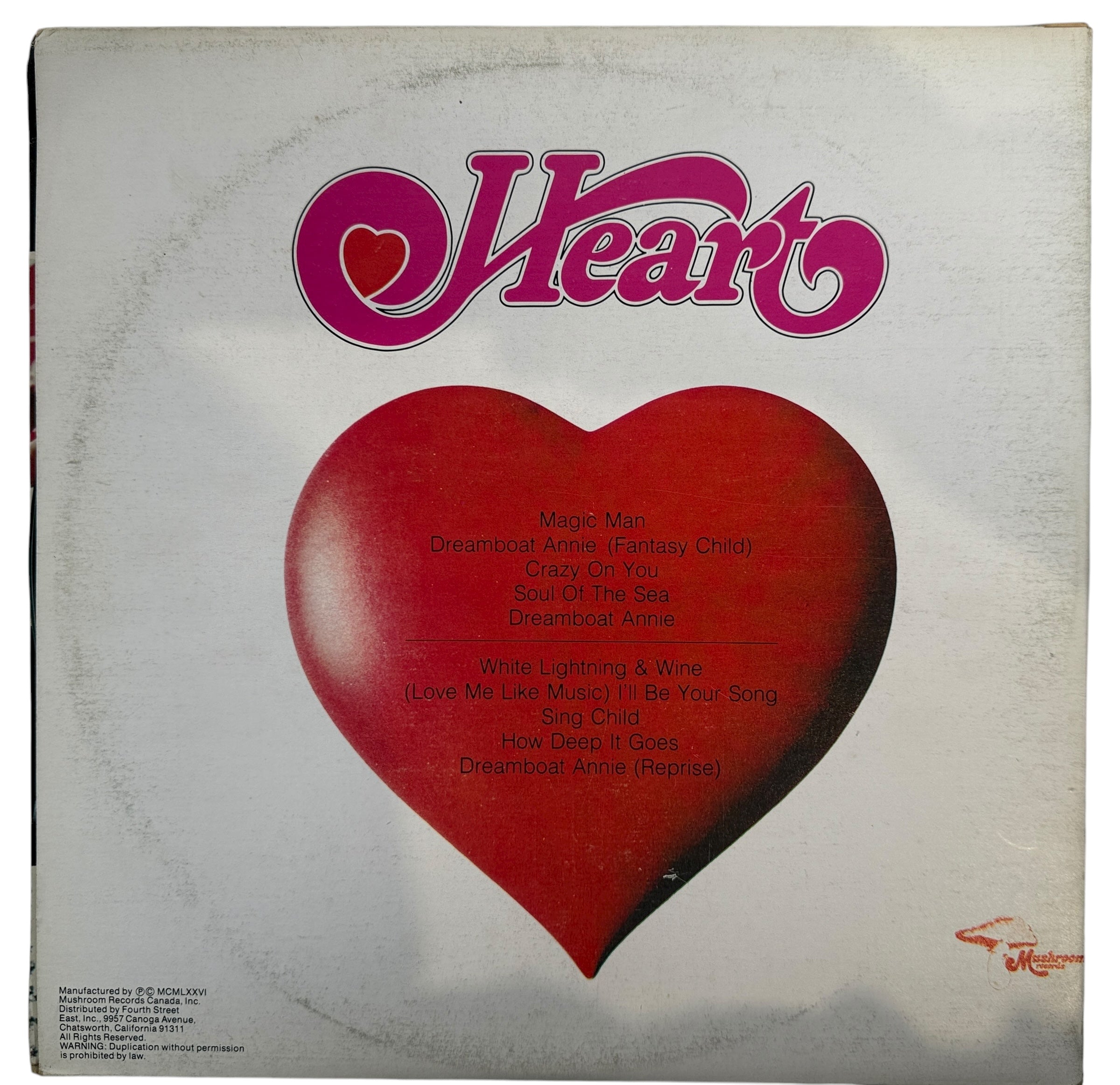 Vintage 1975 Heart Dreamboat Annie Canadian LP on Mushroom Records. Gatefold pressing with classic tracks. Clean collectible copy for rock vinyl fans.