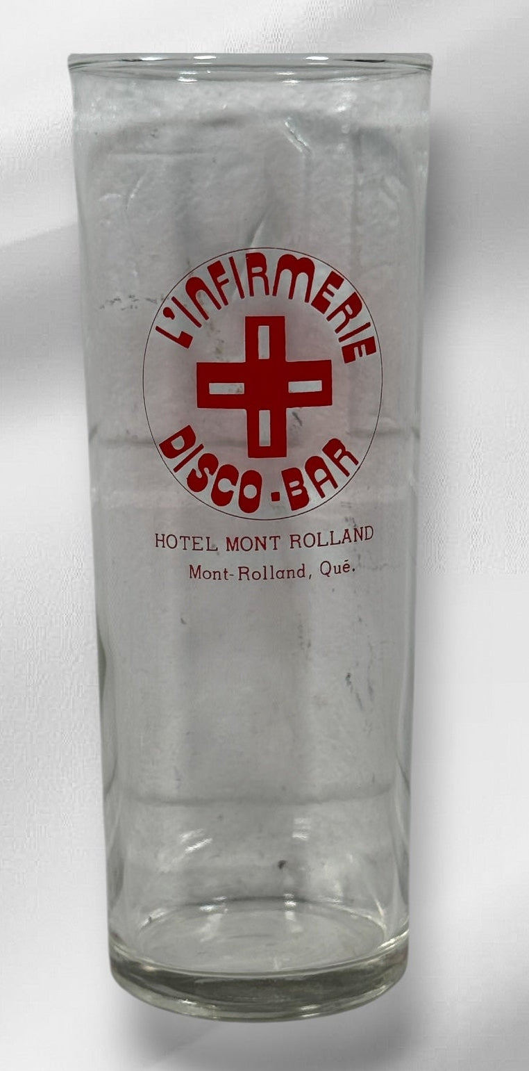 Vintage L’Infirmerie Disco-Bar souvenir glasses from Mont-Rolland, Québec. Rare nightlife memorabilia in excellent condition. Pair of original high-ball glasses.