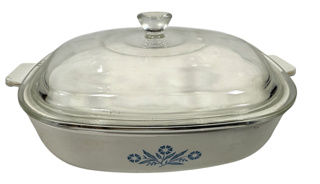 Vintage Corning Ware P-9 Blue Cornflower 9-inch casserole with glass lid. Canadian-made pyroceram cookware. Clean interior and functional vintage condition.