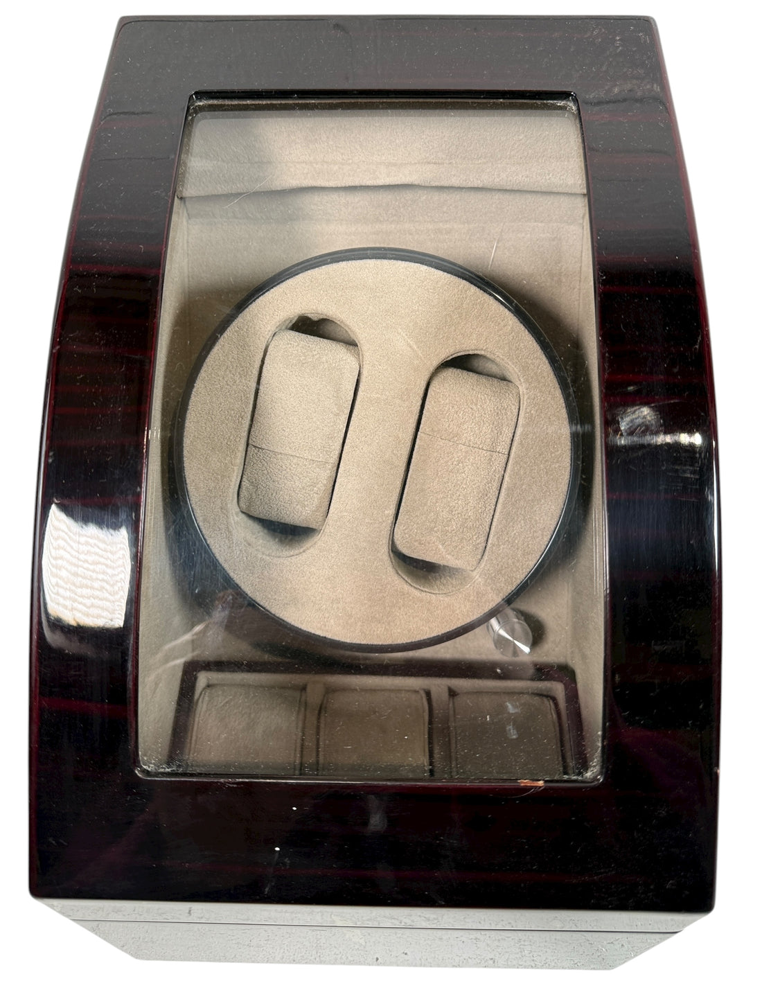 Working dual automatic watch winder in piano black lacquer with storage, display lid, and AC adaptor. Clean, functional, and perfect for protecting your watches.