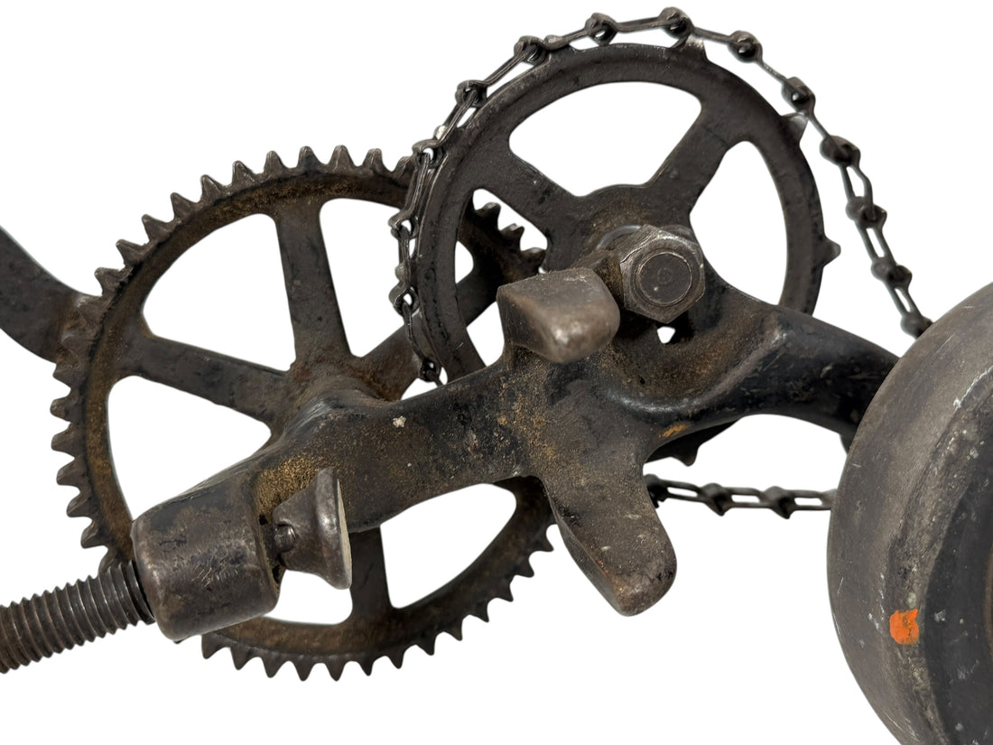 Working antique clamp-on cast-iron grinder with chain drive. Compact 19th-century sharpening tool, fully functional. Industrial décor or collector piece.