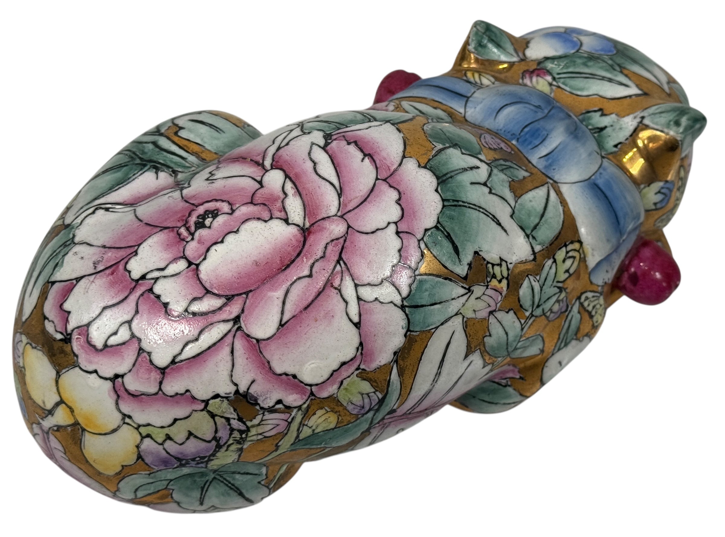 Large 10” Famille Rose porcelain reclining cat with floral enamels and gilt details. Mid-century Chinese export decor piece. Beautiful display sculpture.