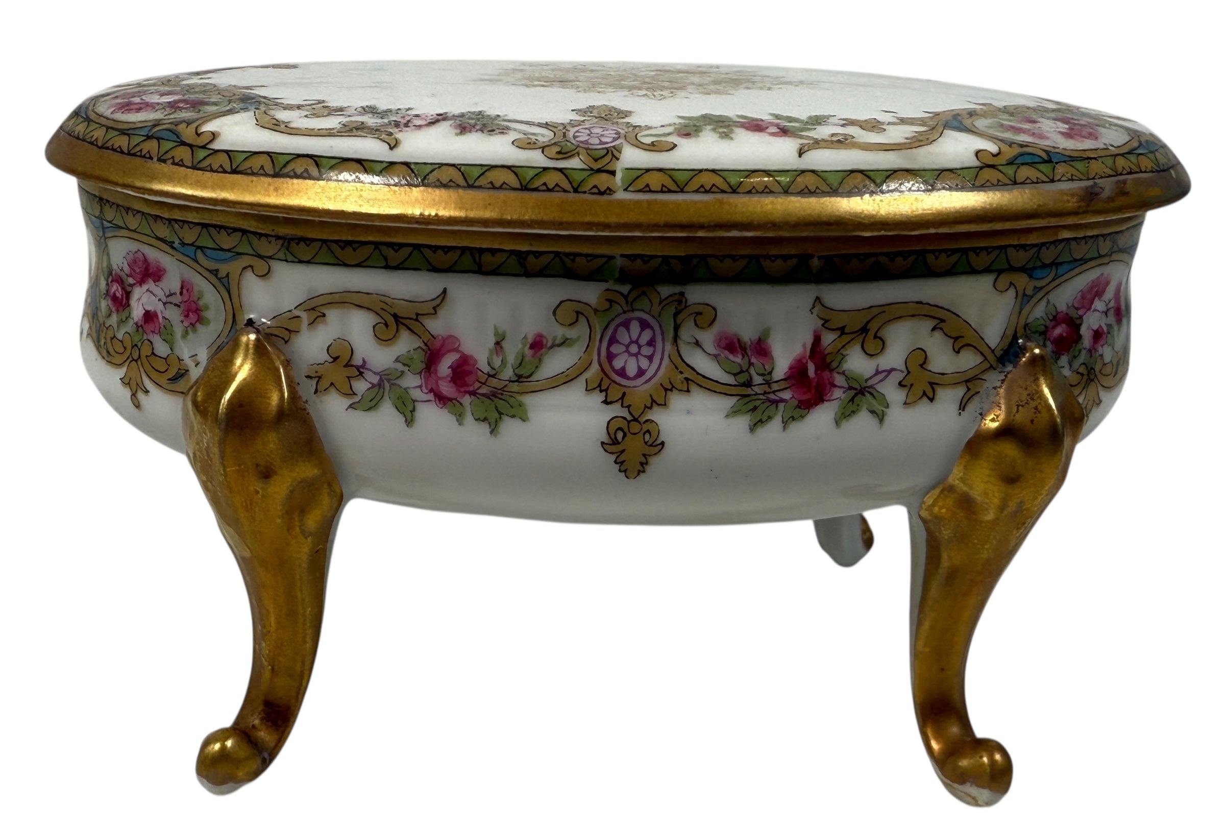 Antique French-style porcelain trinket box with gilt bronze legs, c.1900. Elegant vanity décor with floral details and classic Belle Époque charm.