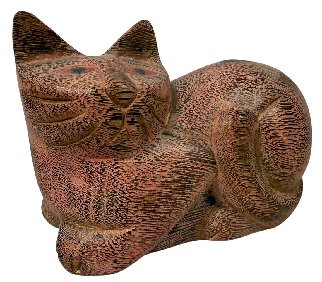 Hand-carved wooden cat sculpture in folk art style. Solid wood, decorative carved texture, warm natural finish. Unique décor piece for cat lovers.