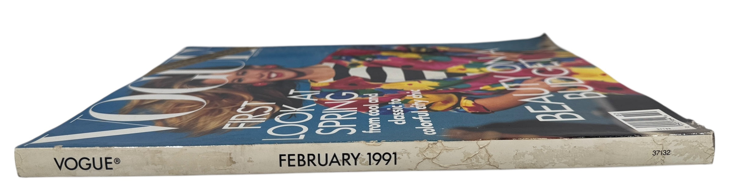Vintage Vogue February 1991 issue featuring Claudia Schiffer, GUESS editorial, and iconic early 90s fashion and Absolut Chicago advertising.
