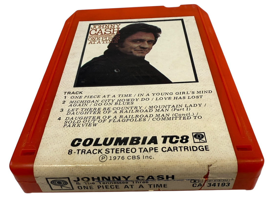 1976 Johnny Cash One Piece at a Time Columbia TC8 8-track tape. Red shell, clean label, collectible outlaw country format. Vintage audio for fans and collectors.