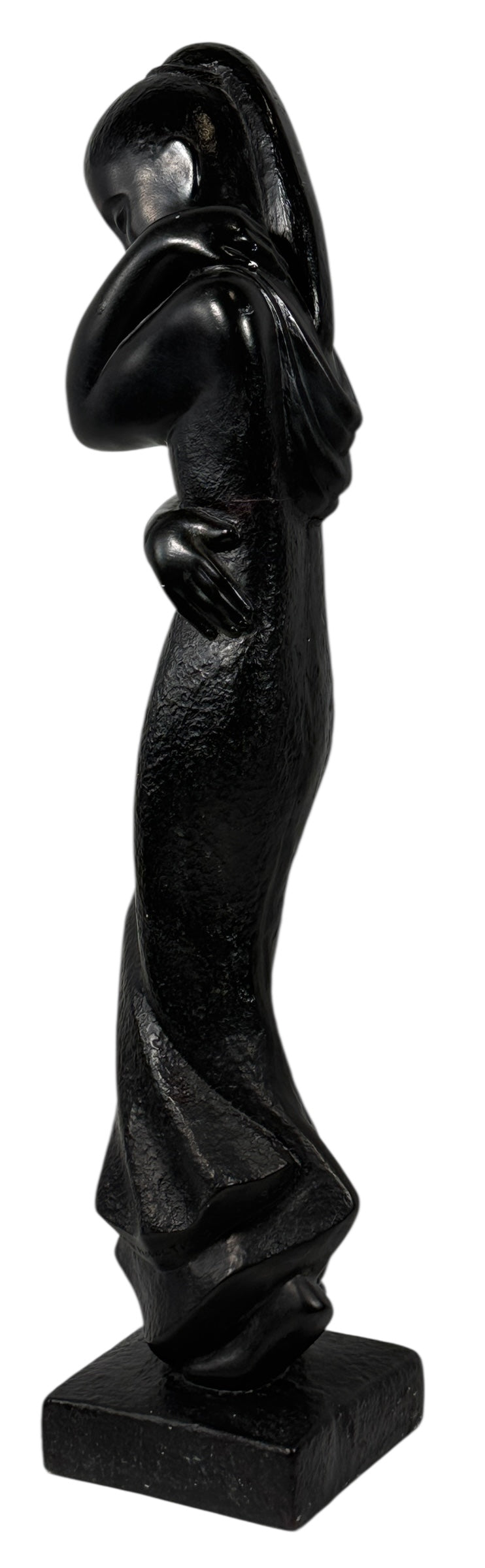 Black abstract sculpture on a white background