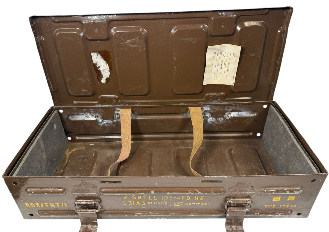 Open military ammunition crate with visible labels on a white background