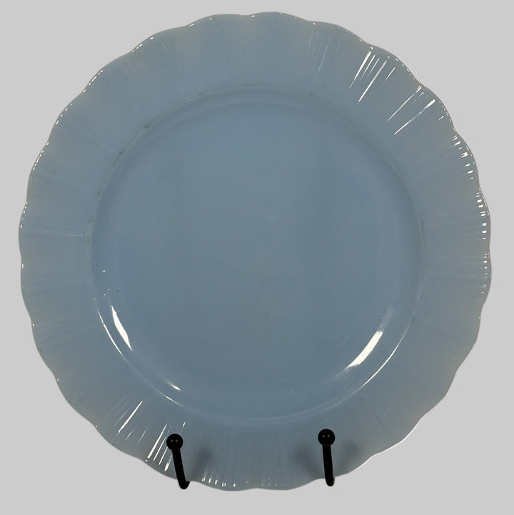 Pyrex Canada , Blue ceramic plate on a stand with a white background