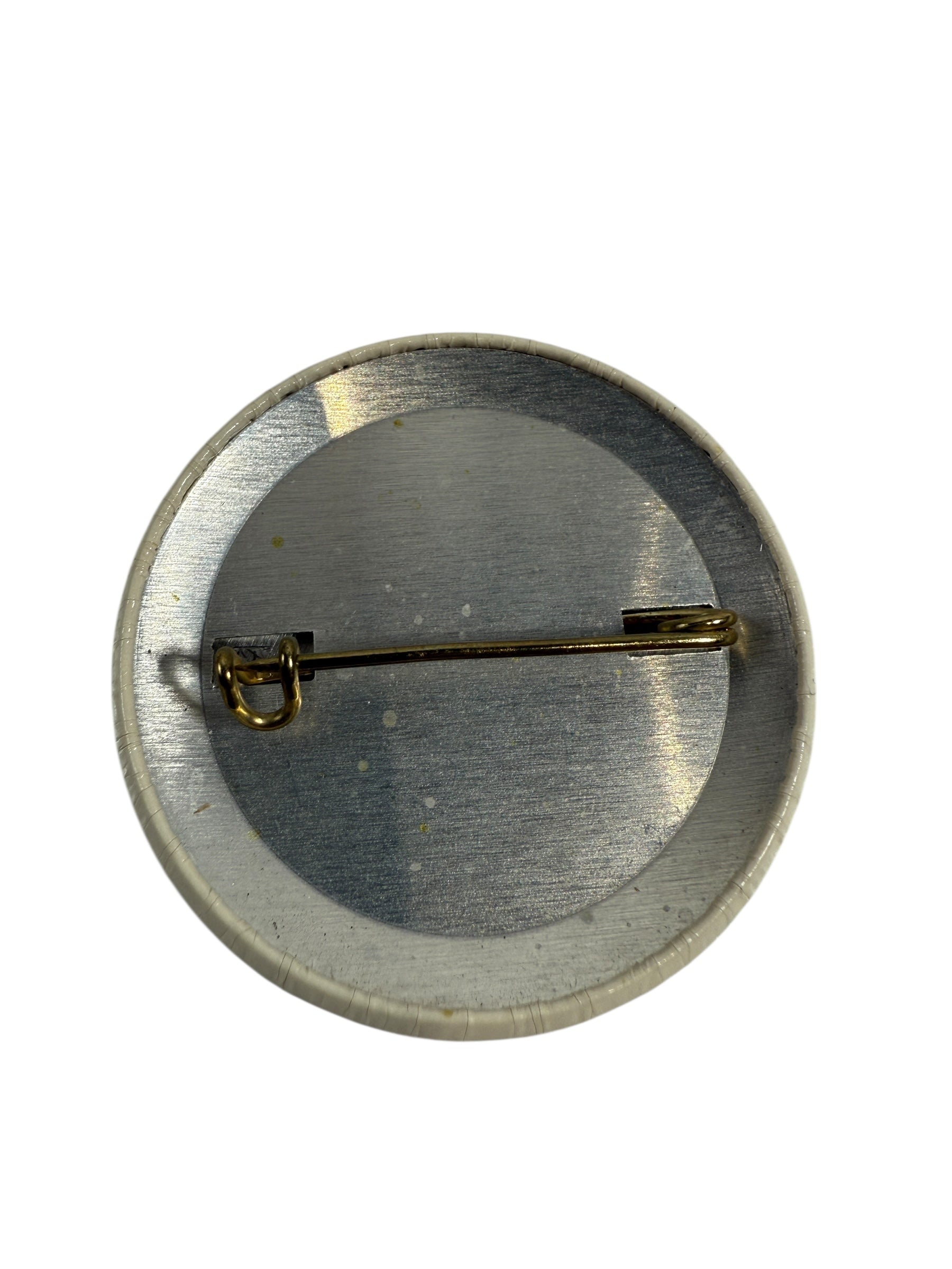 1976 Olympic Button badge with 'Amik' text and black silhouette of a beaver with a red stripe 