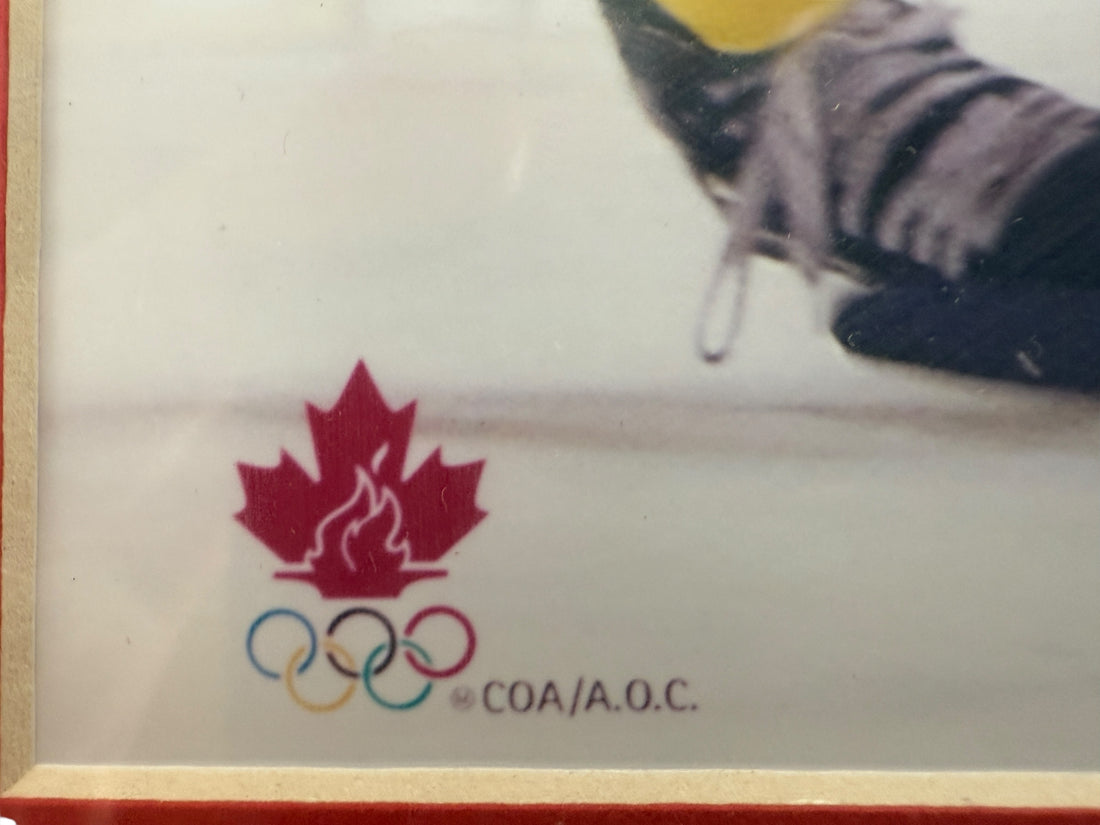 Maple leaf logo with Olympic rings and 'COA/AOC' text on a white background