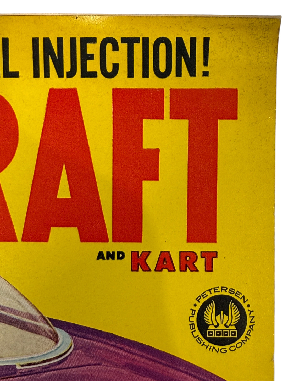Vintage-style advertisement with bold text and a car illustration on a yellow background.