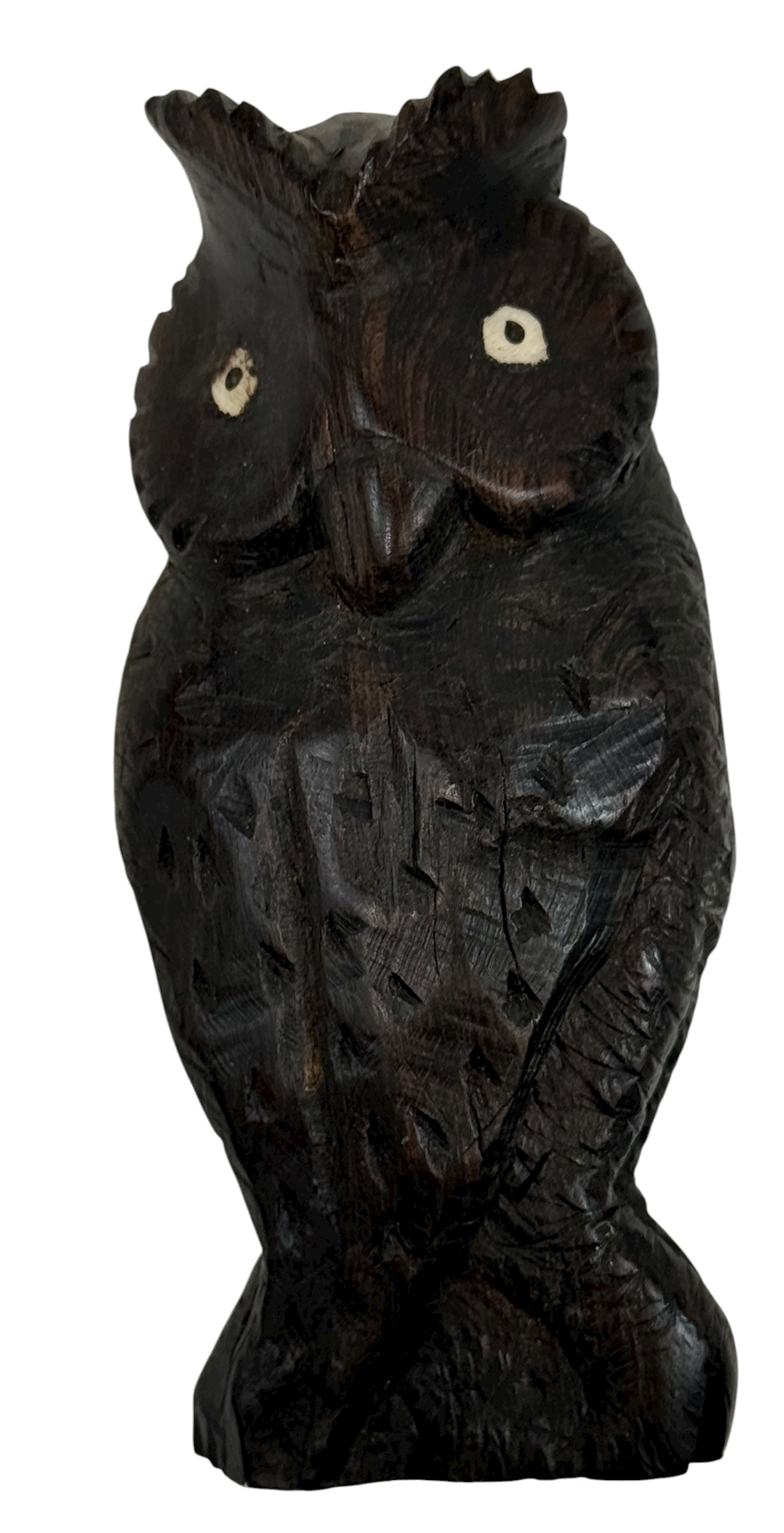 Carved wooden owl figure on a white background
